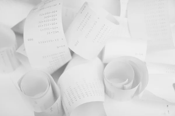 Paper cash register receipts in a lose pile close up with soft f — Stock Photo, Image