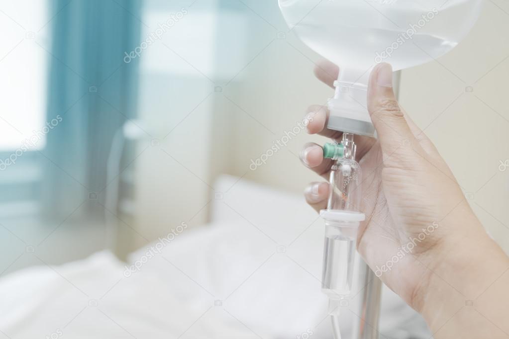 Close up saline IV drip for patient and Infusion pump in hospita