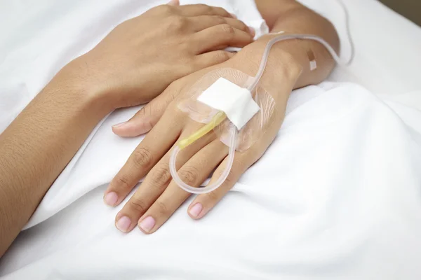 Patient in hospital with saline intravenous (iv) — Stock Photo, Image