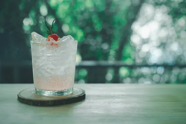 Lychee fizzy drink mix with soda on wood table