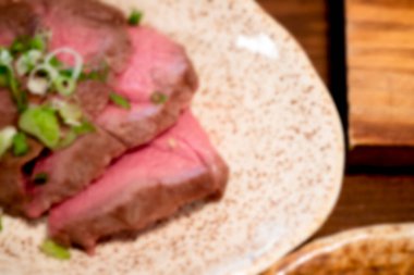 Gurme fileminyon bifteğin bulanık arkaplanı