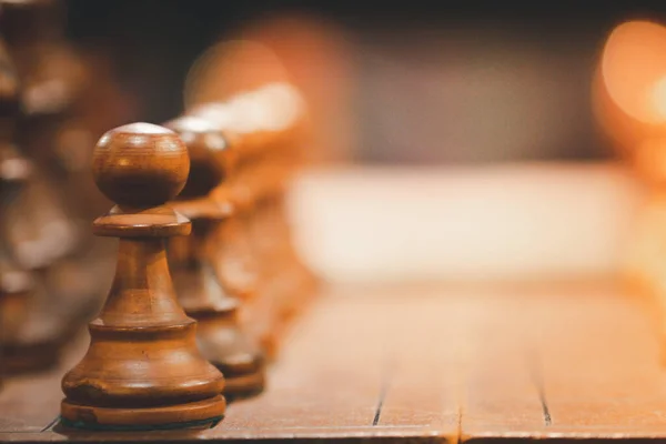 Close up of wooden chess board on table