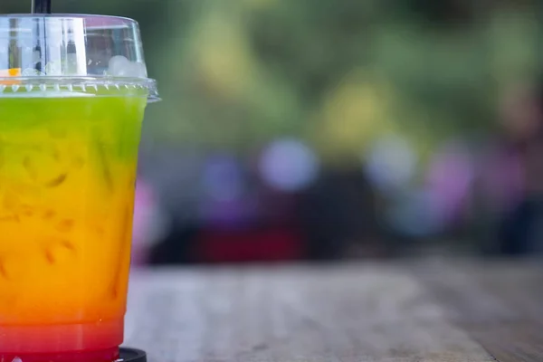 Glass of layered rainbow summer. Exotic summer drink. Copy space