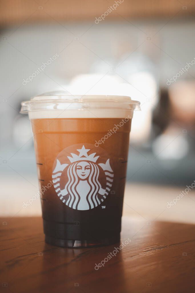 Bangkok, Thailand - January 19, 2021 : Starbucks Nitro Cold Brew Coffee in the Starbucks take away plastic cup. Starbucks is the world's largest coffee house with over 20,000 stores in 61 countries.