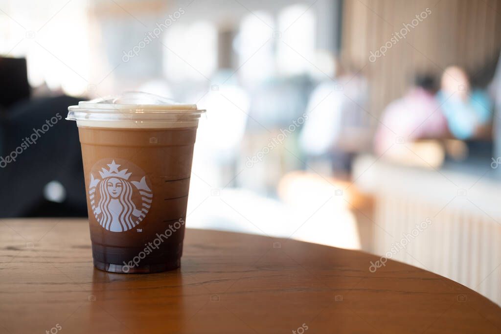 Bangkok, Thailand - February 28, 2021 : Starbucks Nitro Cold Brew Coffee in the Starbucks take away plastic cup. Starbucks is the world's largest coffee house with over 20,000 stores in 61 countries.