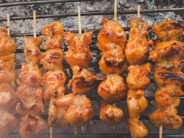 Chicken ass in skewered on the stove. Street foods in Thailand