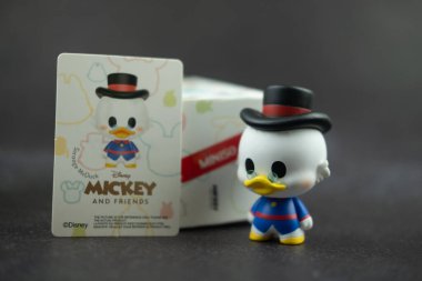 Samut Prakan, Thailand - May 22, 2021 : Cute figurine Scrooge McDuck collections from blind box in Miniso shop in Thailand