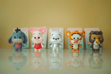 Samut Prakan, Thailand - May 22, 2021 : Cute figurine of Winnie the pooh Figures Mystery Blind box collection sell in Miniso shop in Thailand.