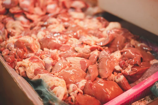 Fresh pig organs for sale in the fresh Thai market at the morning.