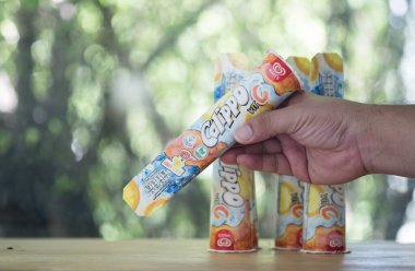 Samut Prakan, Thailand - June 23, 2021 : The new Walls Calippo with Vitamin C. Walls Calippo in Thailand now comes with a vitamin fortified version and comes with the Healthier Choice logo.