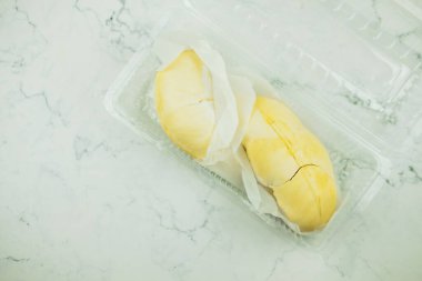 Durian peeled in plastic box for the customer take home, available during the season.