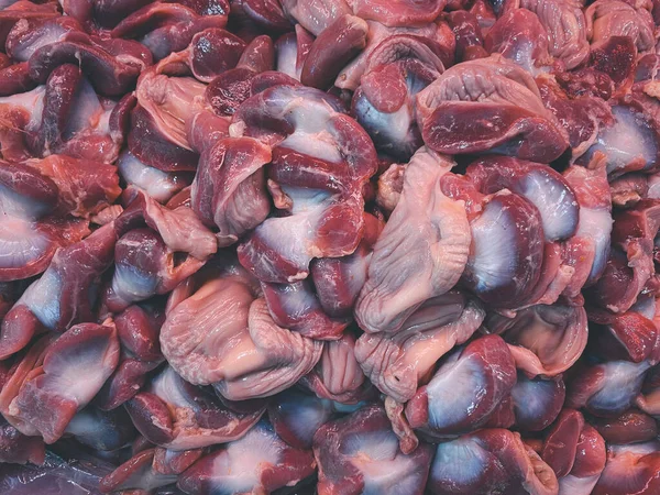 Fresh pig organs for sale in the fresh Thai market at the morning.