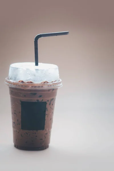 Iced mocha coffee in plastic cup with blank logo on glass
