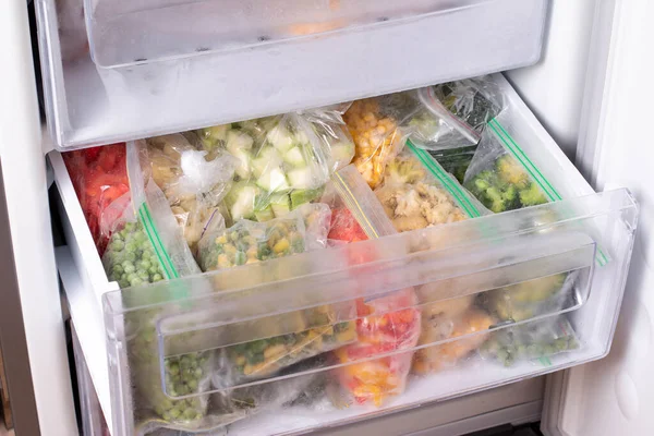 Assortment of frozen Vegetables in home fridge. Frozen food in the freezer