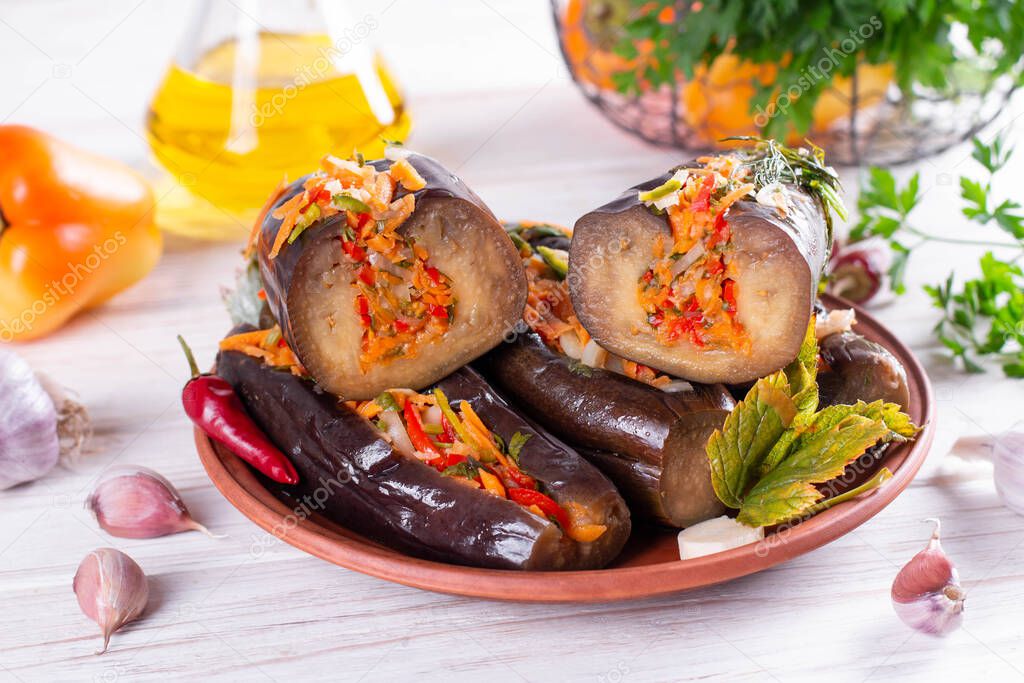 Traditional Azeri pickled eggplants famous in Southern Azerbaijan on a wooden table