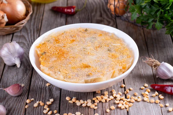 Frozen soup in a bowl on a wooden background. Frozen food, healthy food — Stock Image Frozen Soup Bowl Wooden Background Frozen Food Healthy Food Royalty Free Stock Photos