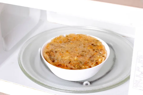 Frozen soup in the microwave. Frozen food, healthy food — Stock Image Frozen Soup Microwave Frozen Food Healthy Food Stock Photo