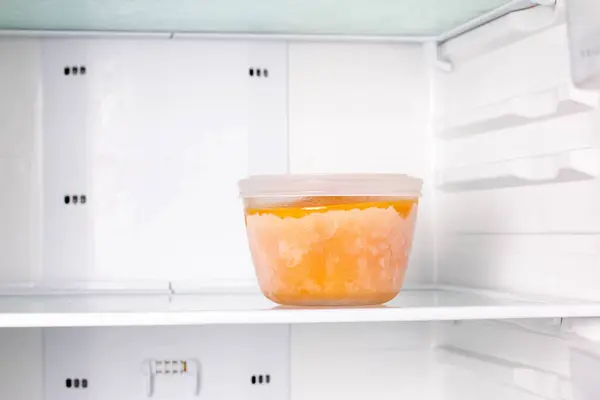 Frozen pumpkin soup in the refrigerator. Frozen food. Frozen soup. Preparing food for the week — Stock Image Frozen Pumpkin Soup Refrigerator Frozen Food Frozen Soup Preparing Food Stock Picture