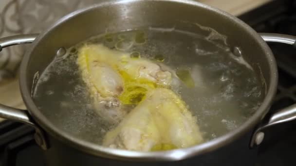 Broth is chicken boiling in a saucepan. Health food — Stock Footage Broth Chicken Boiling Saucepan Health Food Video Clip