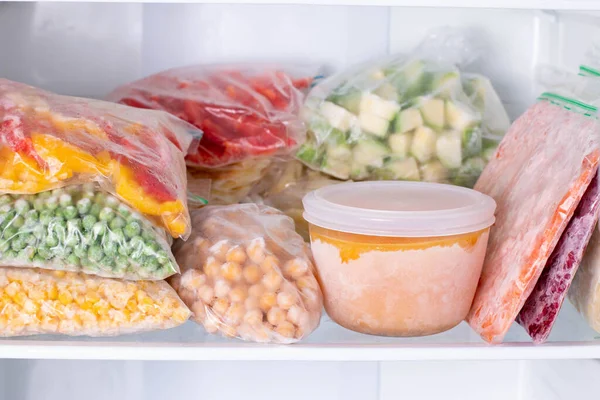 Frozen food in the freezer. Frozen vegetables, soup, ready meals in the freezer — Stock Image Frozen Food Freezer Frozen Vegetables Soup Ready Meals Freezer Stock Image
