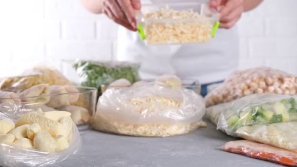 Woman Puts Container Frozen Food Frozen Grated Cheese — Stock Video