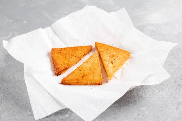 Fried bread on a napkin.. The process of making bread pudding or Shahi tukra. Step by step recipe