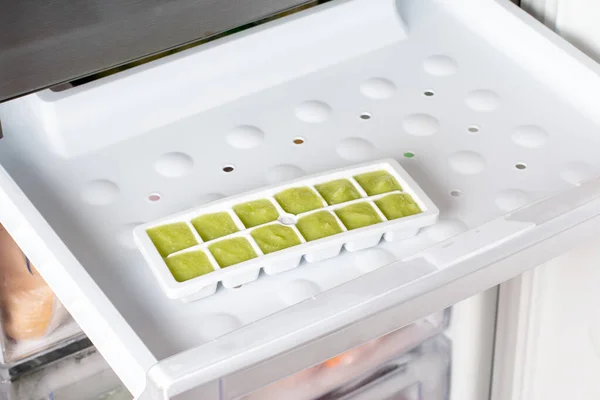 Frozen Zucchini Puree Ice Cubes Tray Refrigerator Frozen Food Concept — Stock Photo, Image