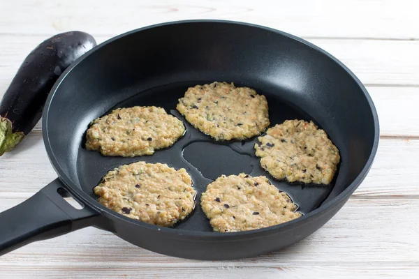 Eggplant pancakes, pan fried snack pancakes from minced eggplant. Healthy veggie recipe.