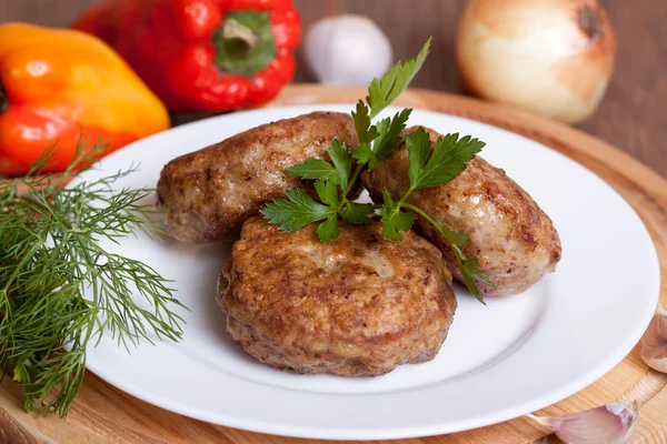 Fried cutlet with parsley on a plate — Stock Photo, Image