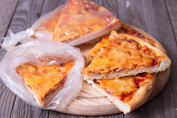 Harvesting of pizza in the package — Stock Photo, Image