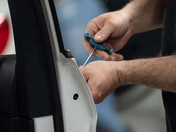 Repairing dents in a car