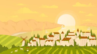 Gün batımında kıyı manzarası, çiftlik evleri, yel değirmeni ve deniz koyuyla kıyı köy manzarası.