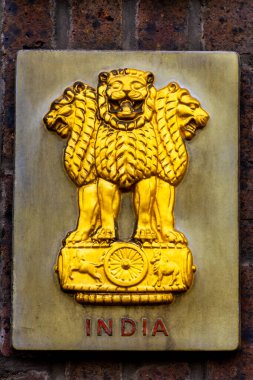 A representation of the Lion Capital of Ashoka was initially adopted as the emblem of the Dominion of India in December 1947 showing 4 lions facing in the four compass directions clipart