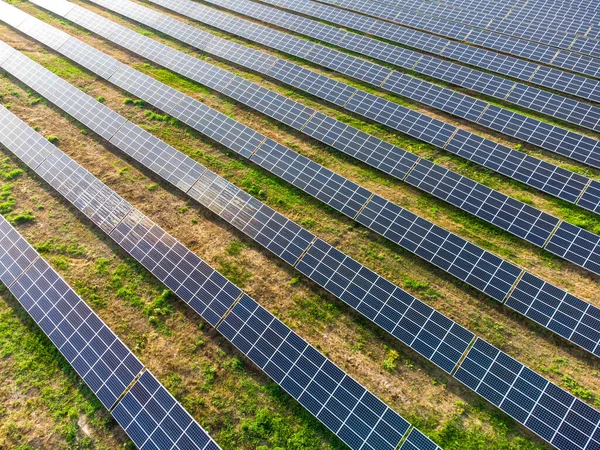 Solar panels in the field. Solar farming in the field. Solar panels farming