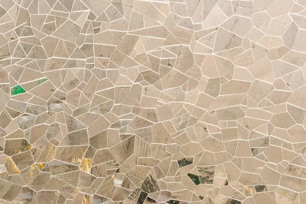 Glass mosaic wall decoration. Beige warm texture background