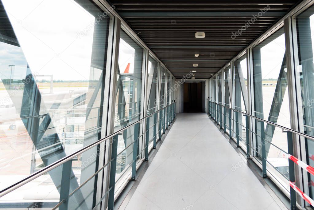 Airplane boarding terminal gate bridge tunnel of an international airport.