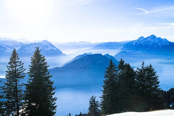 Swiss Alps Mount Pilatus towering over foggy misty Vierwaldstattersee, Lake Lucern, Switzerland — Stock Photo, Image