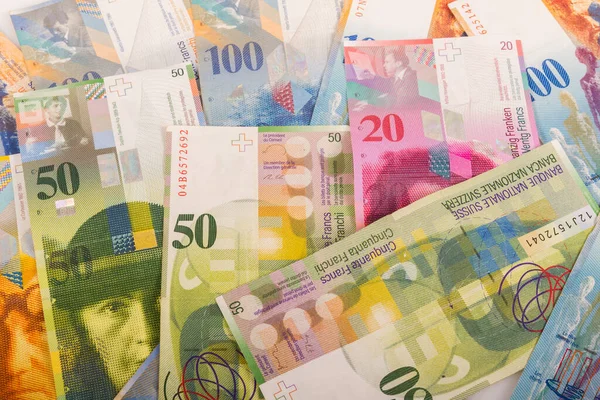 Bank bills of 100, 50, 20, and 10 CHF Swiss banknotes — Stock Photo, Image