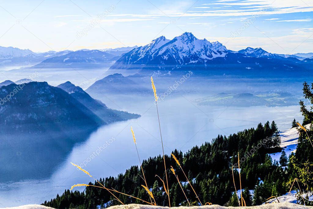 Mount Pilatus towering over foggy misty Vierwaldstattersee, Lake Lucern, Switzerland