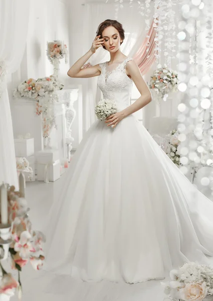 Woman posing in a wedding dress — Stock Photo, Image