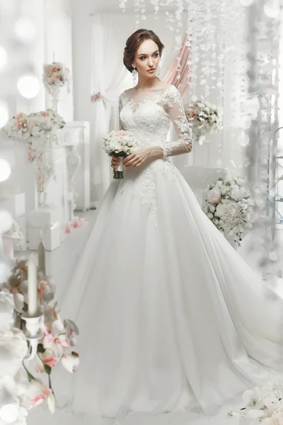 Woman posing in a wedding dress — Stock Photo, Image
