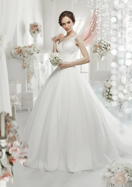 Woman posing in a wedding dress — Stock Photo, Image