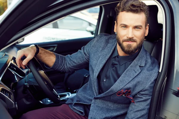 Portrait handsome elegant man in a car — Stock Photo, Image