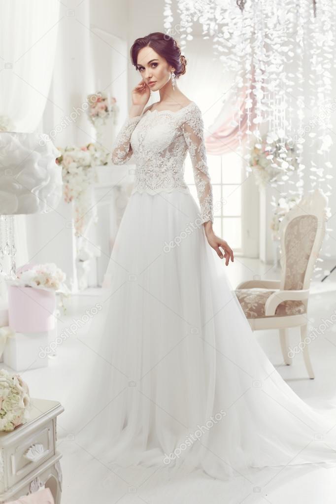 Woman posing in a wedding dress