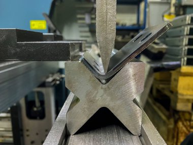 Bending of sheet metal parts using a sheet metal bending machine clipart
