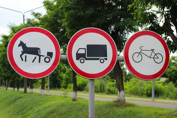 International traffic signs \'No animal drawn vehicles\', \'No Trucks\', \'No Bicycles\'
