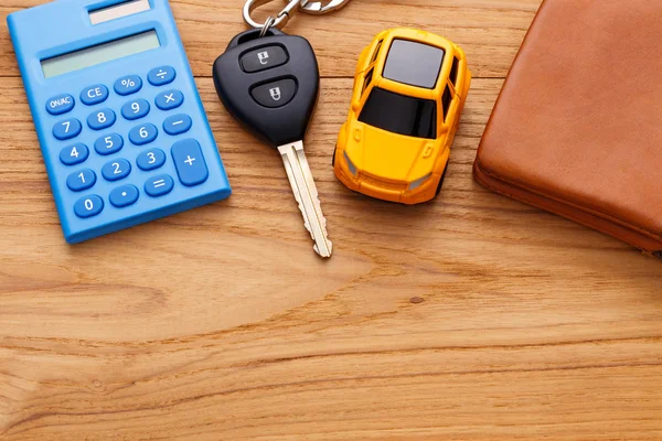 Car key with pocket money on wood background — Stock Photo, Image