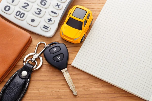 Car key with calculator and pocket money — Stock Photo, Image