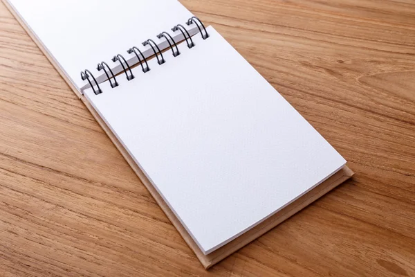 Notebook open on wood table — Stock Photo, Image