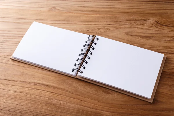 Notebook on wood desk — Stock Photo, Image